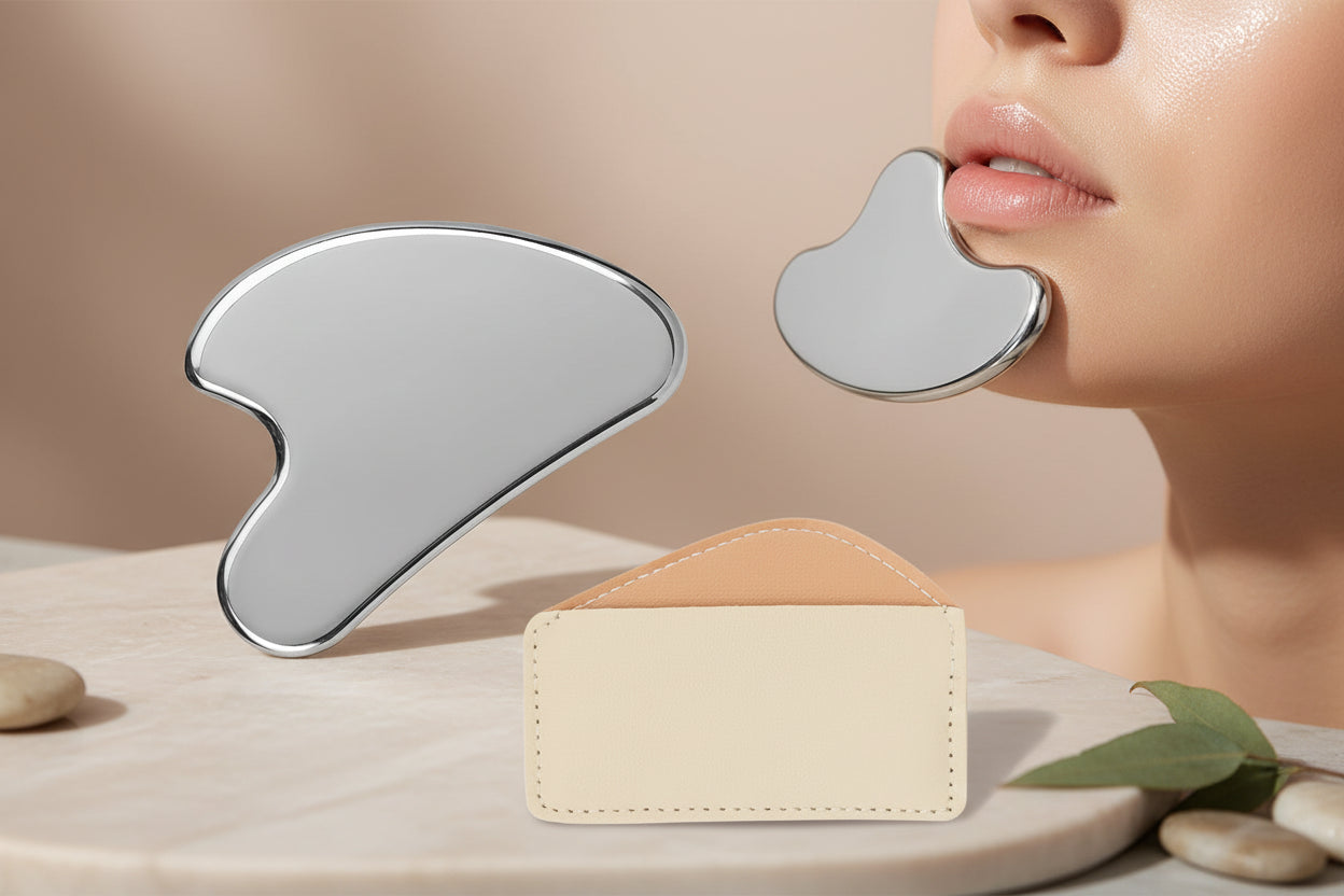 Silver Gua Sha tool and beige leather case on a white background