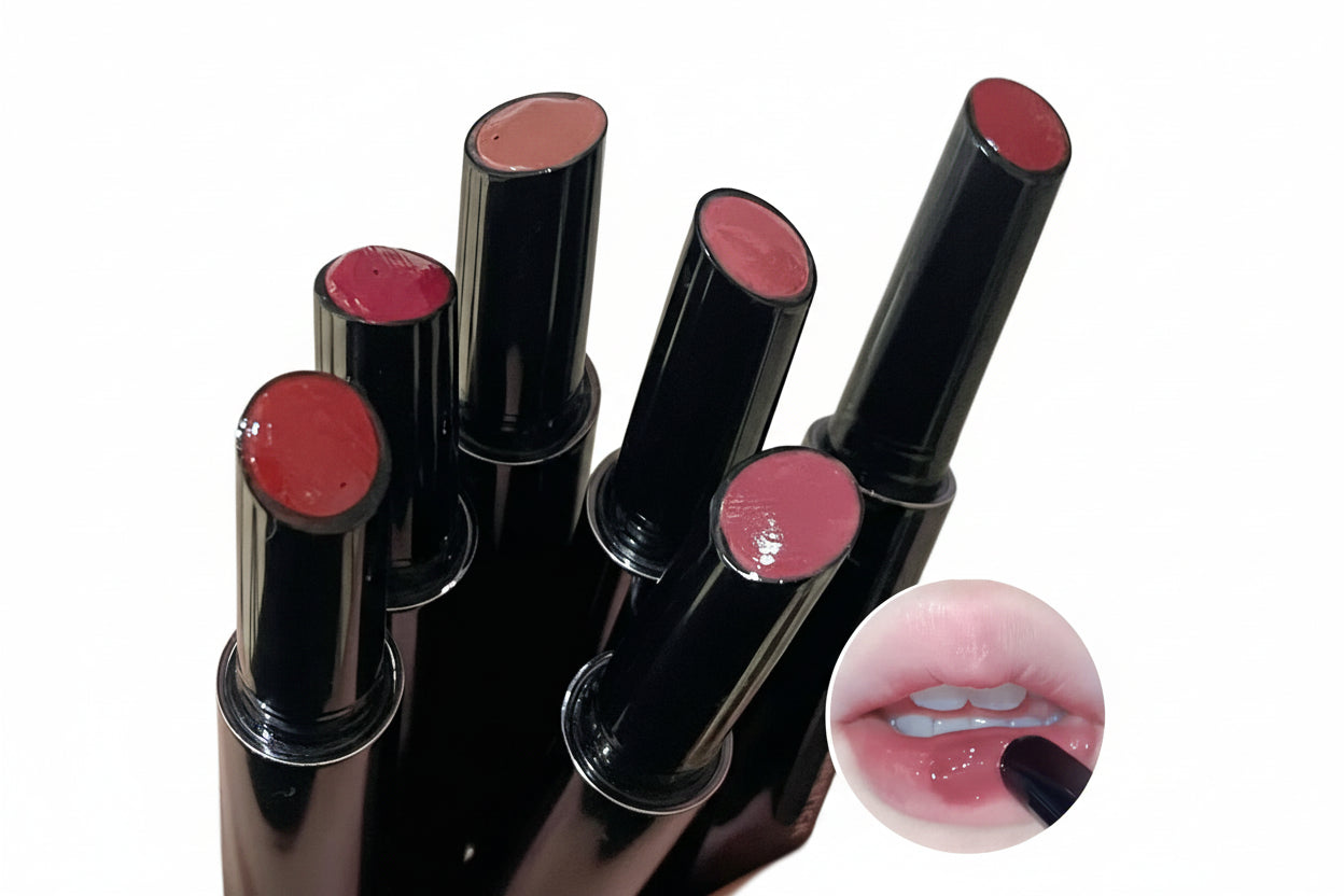 Set of black lipsticks with pink shades on a white background