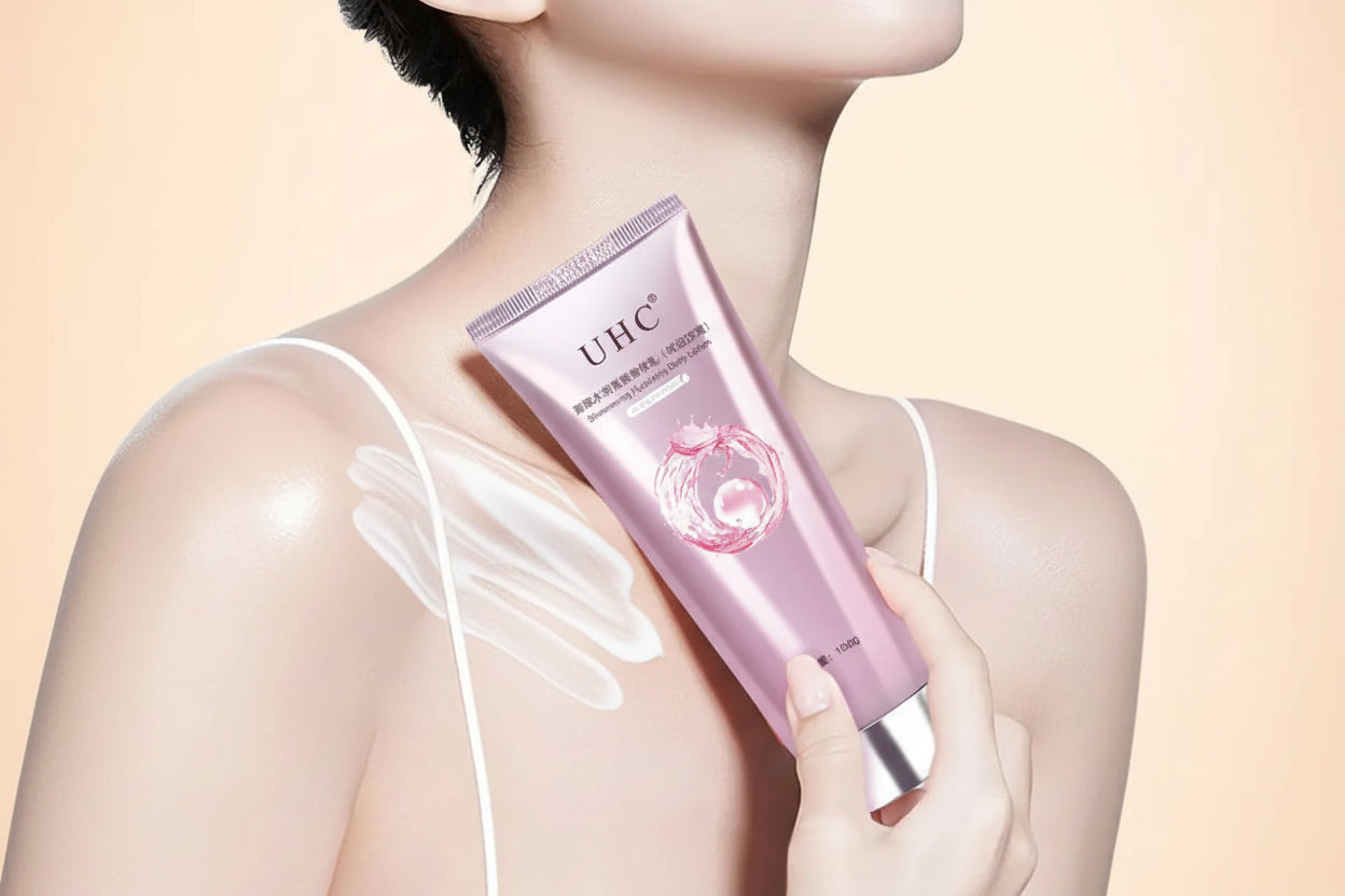 Person holding a pink UHC skincare product against a beige background