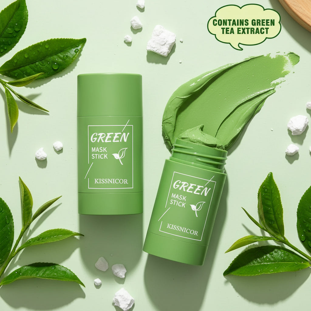 Green mask stick with packaging and green tea leaves on a light green background